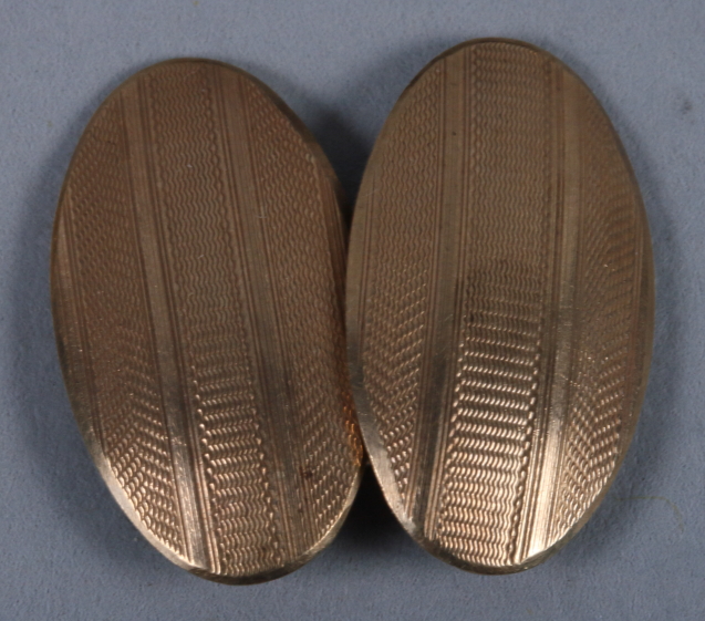 A pair of 9ct gold cufflinks with engine turned decoration and a yellow metal chain, 8g gross - Image 3 of 3