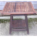 A teak slatted top two-tier conservatory/occasional table, 28" square