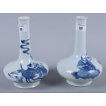 A pair of Chinese blue and white figure decorated sprinkler bottles, 8 1/4" high