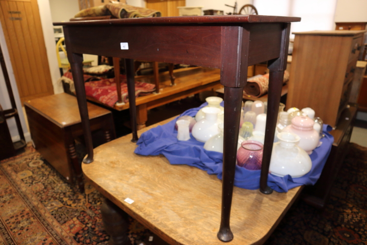 A Cuban mahogany side table, on pole turned supports and pad feet, 36" wide