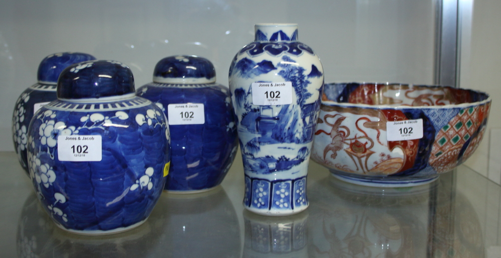 A Japanese Imari bowl, 10" wide, three Chinese ginger jars with prunus decoration, and a Chinese