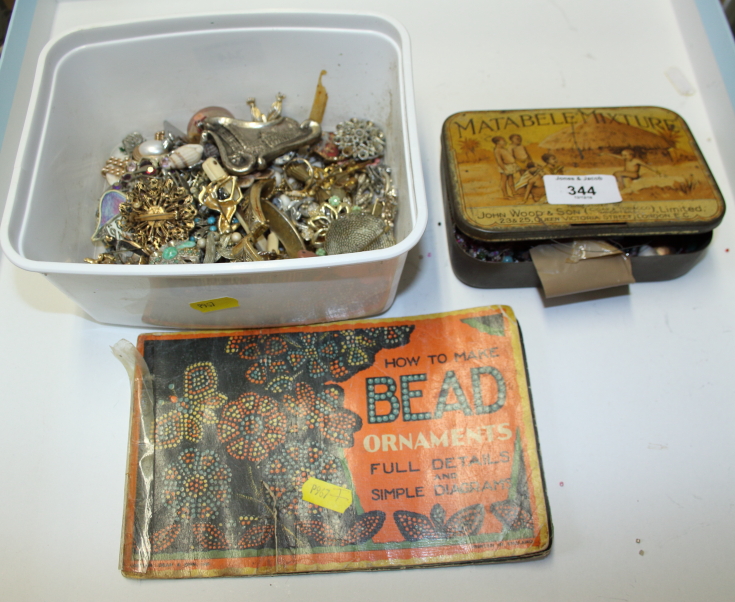 A collection of costume jewellery, including brooches, bracelets, etc, together with a bead ornament