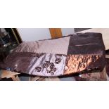 A patchwork quilt with square panels of embroidered brown fabric, 92" x 88" approx