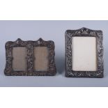 A silver Arts & Crafts embossed photograph frame, 7" high, and an embossed silver double