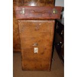 A leather trunk and a leather suitcase