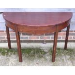 A mahogany semicircular side table, on chamfered supports, 40" wide