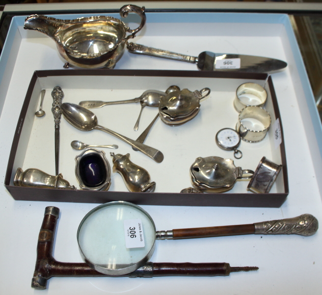 A silver sauce boat, three silver napkin rings, three silver spoons and various other silver items