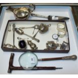 A silver sauce boat, three silver napkin rings, three silver spoons and various other silver items