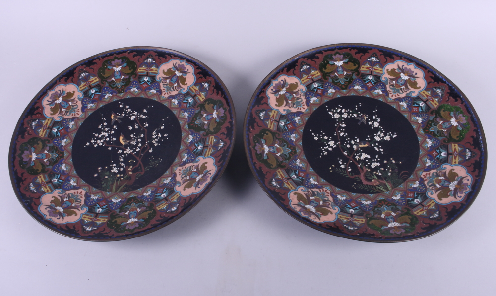 A pair of Japanese cloisonne chargers with bird and tree centres, 14" dia (one a/f)