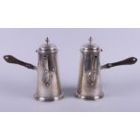 A pair of George V Asprey & Co silver coffee pots, each with turned horn handles, on stepped