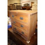 A satin walnut chest of three drawers with stamped brass handles, 30" wide