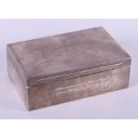 A silver cigarette box, 9" wide