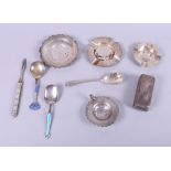 Two silver ashtrays, a pin tray, a pin box, a strainer, a preserve spoon, 7.4oz troy approx and