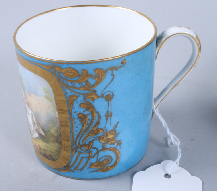 A Sevres porcelain coffee can, single panel decorated young lovers, gilt highlights on a blue - Image 3 of 7