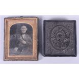 A daguerreotype of an elderly gentleman and another similar of a woman, in a pressed hinged case