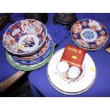 An Imari bowl, 8 1/2" wide, four Imari plates, other decorative plates and two coffee cans