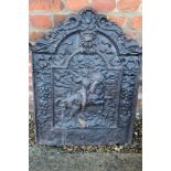 A cast iron fire back with George and Dragon design