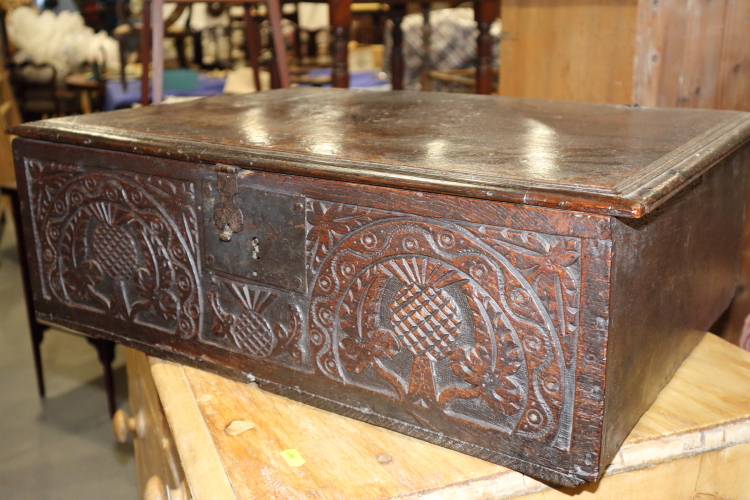 A late 18th century carved oak bible box with thistle decoration, 24 1/2" wide