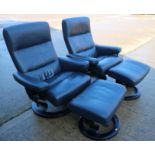 A pair of "Stressless" grey leather armchairs and matching stools, on circular bases