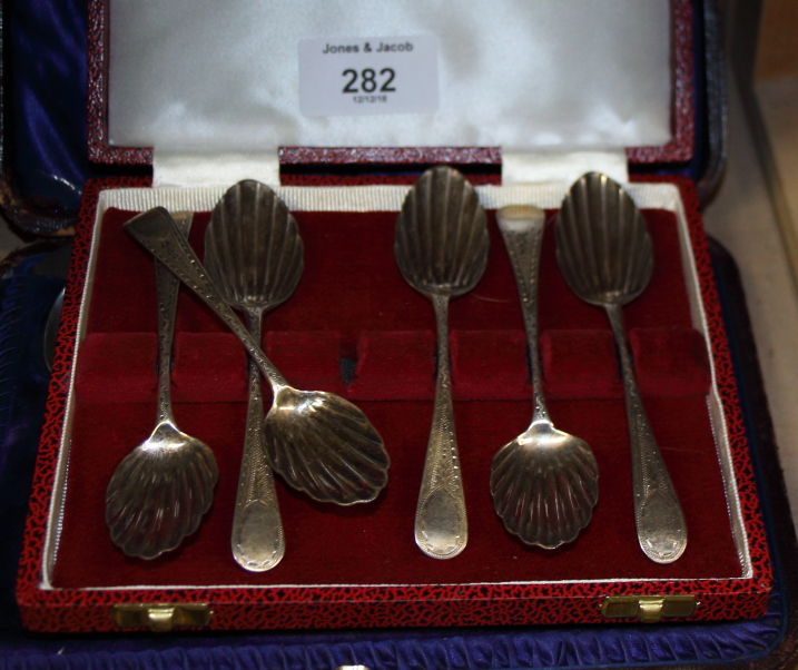 A set of six Georgian bright cut shell bowl teaspoons, in case, four engraved silver teaspoons and a