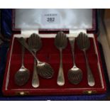 A set of six Georgian bright cut shell bowl teaspoons, in case, four engraved silver teaspoons and a