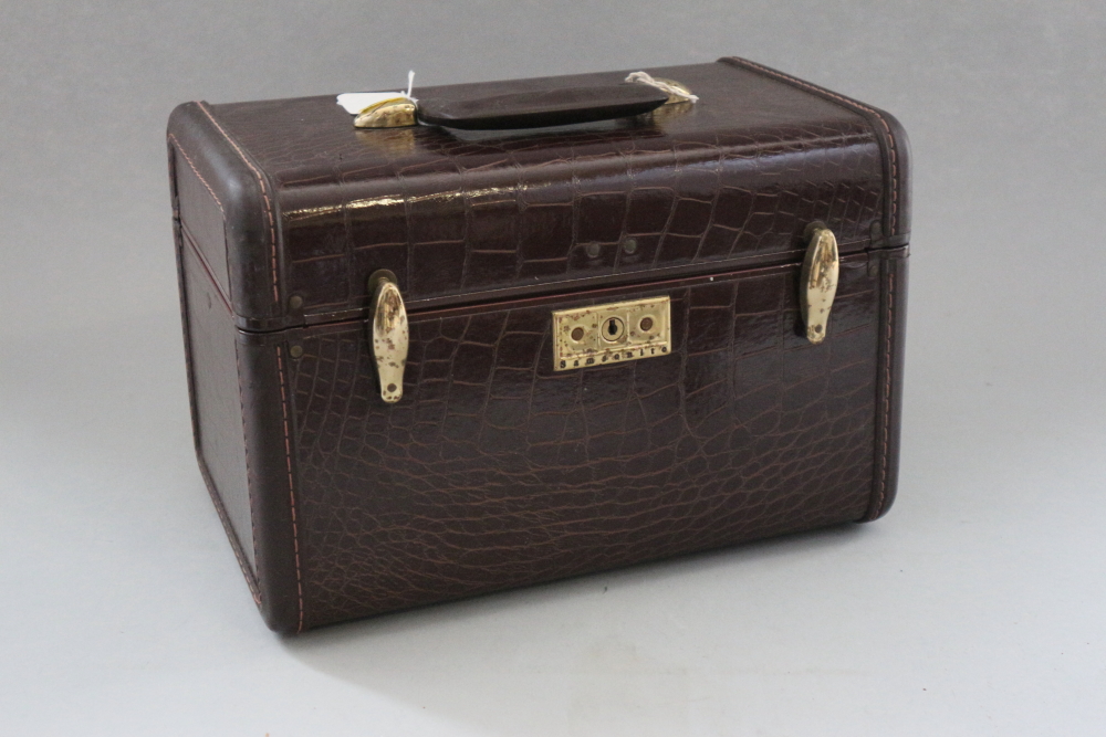 A Samsonite mock crocodile vanity case and a matching suitcase