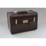 A Samsonite mock crocodile vanity case and a matching suitcase