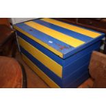 A blue and yellow painted pine blanket chest, 39" wide