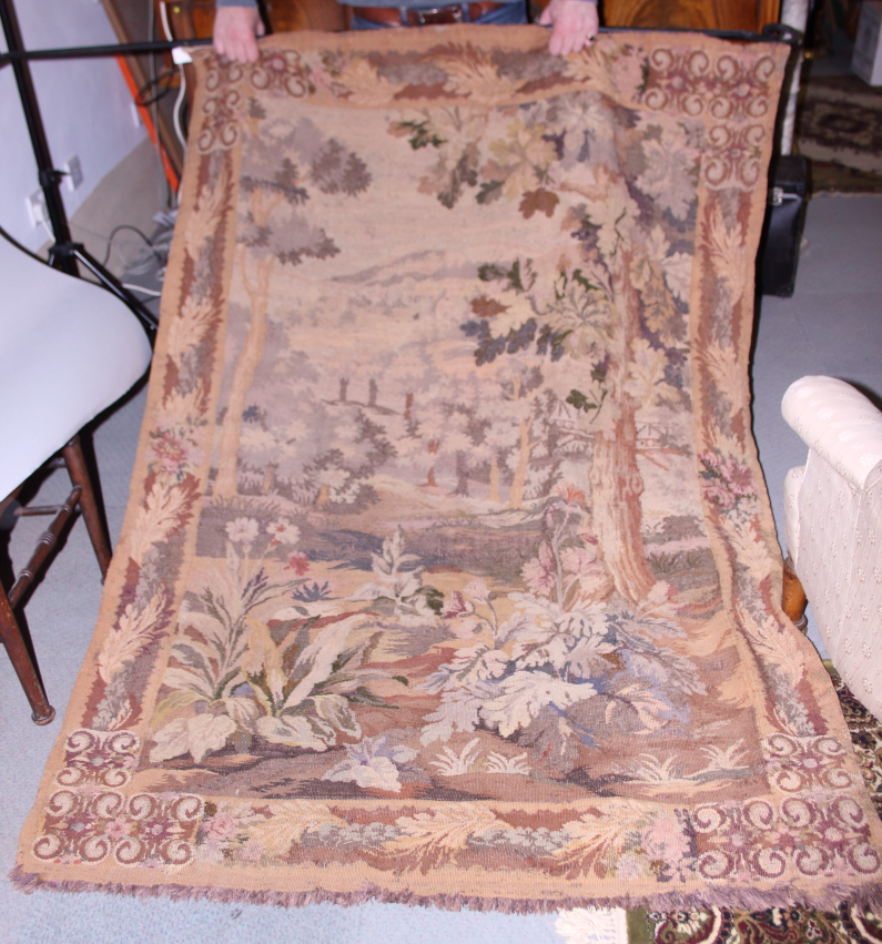 An 18th century verdure tapestry panel of a forestry scene, 72" drop x 52" wide