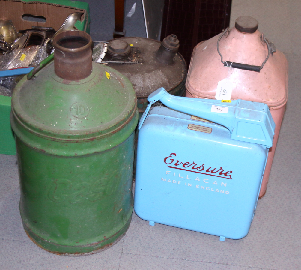 A "Quaker State" motor oil can, an "Eversure" fill can and two other fuel cans