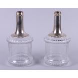 A pair of French early 20th century silver mounted mallet form decanters with floral decoration,