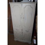 A dove grey painted side cabinet, fitted two drawers, on stile supports, 20" wide