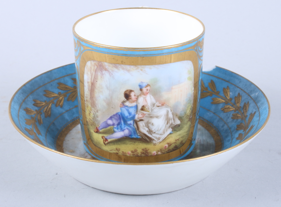 A Sevres porcelain coffee can, single panel decorated young lovers, gilt highlights on a blue