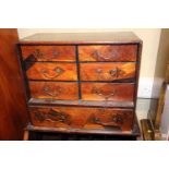 A Japanese marquetry cabinet, fitted six small and one long drawer, 20" wide