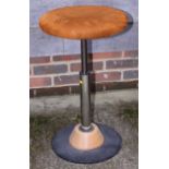 A circular top bar stool, on chrome support, and a wash table