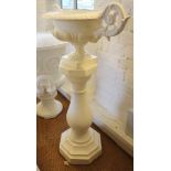 A cast iron scroll handle vase, on cast stone pillar base, 38" high overall