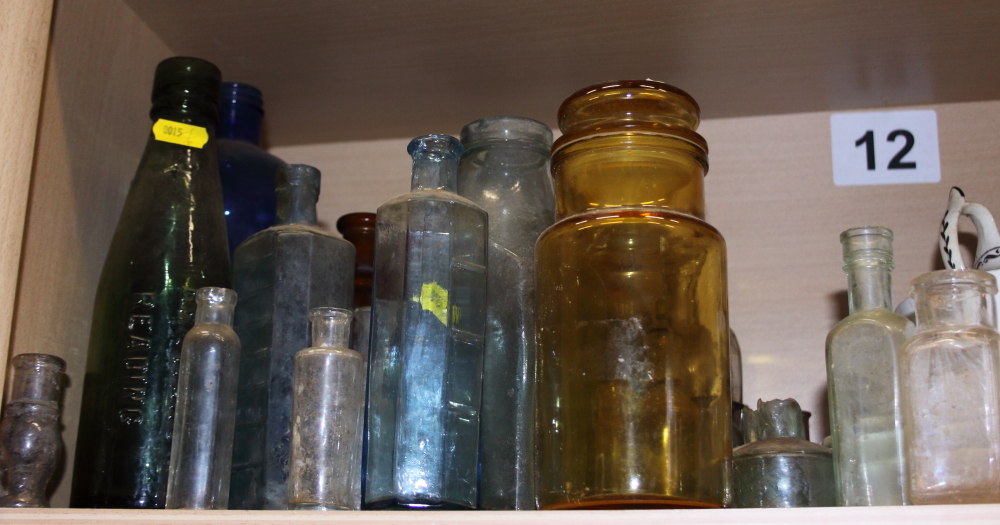 A large collection of medicine and other glass bottles