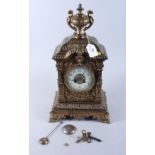 A 19th century brass cased Japy Freres bracket clock with urn finial, white enamel dial with