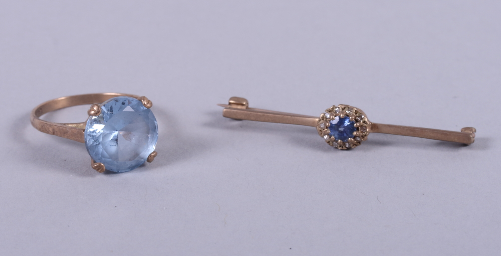 A 9ct gold ring set aquamarine coloured stone, size K, and a similar bar brooch