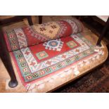 A Kazak design runner with two yellow hexagonal hooked guls on a red ground, 28" x 94" approx