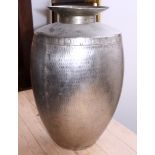 A hammered steel jar with flared rim, 23" high