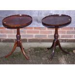 Two oval piecrust occasional tables, on turned column and tripod splay supports