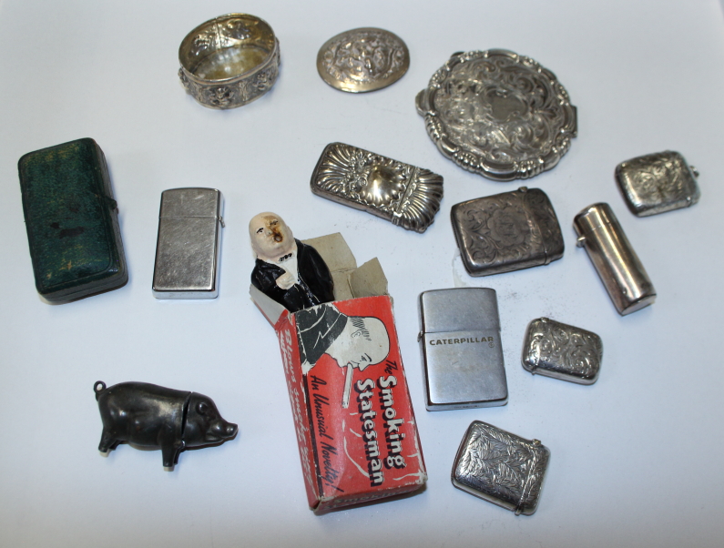 Five silver vesta cases, a white metal compact, a silver scent bottle (lacking interior), a metal