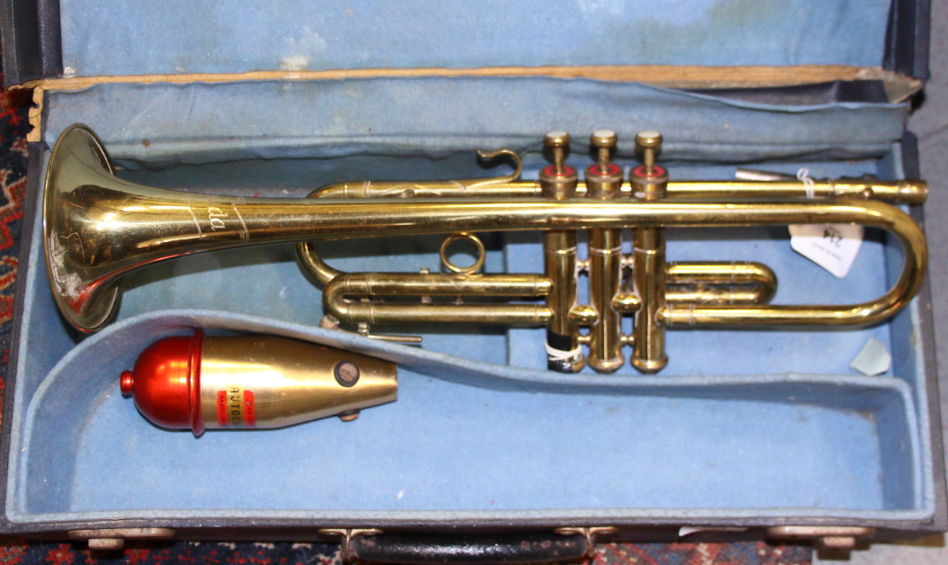 A Nevada brass trumpet, in case