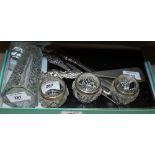 A cased set of six silver handled butter knives, a cut glass and silver mounted scent bottle,