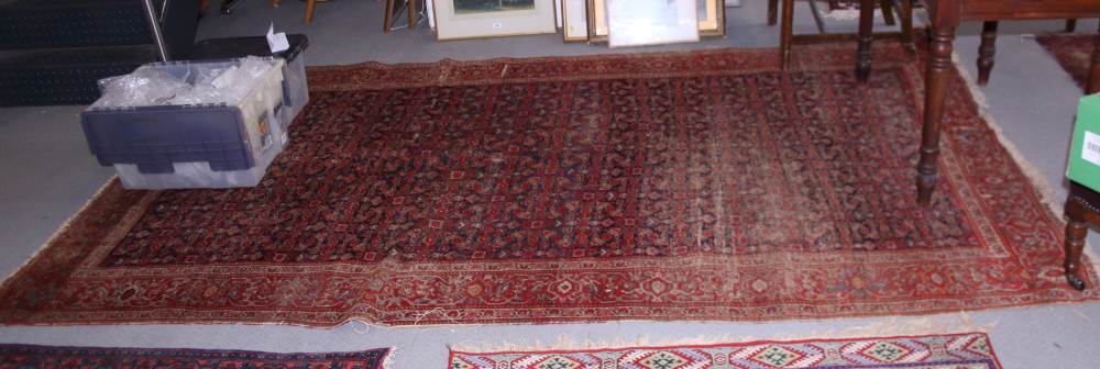 A Feraghan? rug with all-over Herati design on a blue ground, 120" x 69" approx (worn)