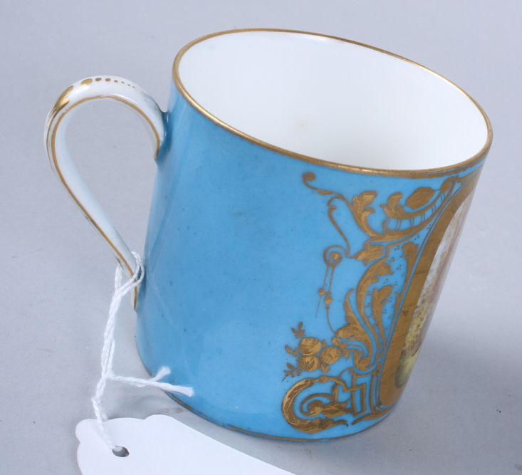 A Sevres porcelain coffee can, single panel decorated young lovers, gilt highlights on a blue - Image 5 of 7