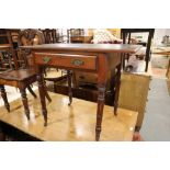 An Edwardian walnut writing table, fitted one drawer, on turned supports, 36" wide