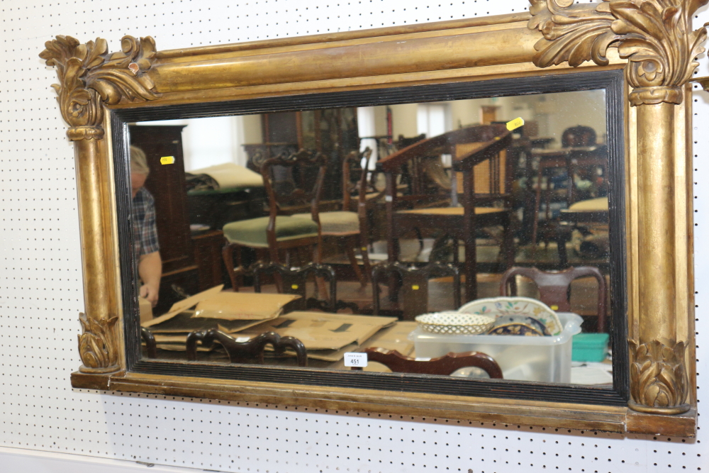 A 19th century oval giltwood framed overmantel mirror with acanthus decoration, plate 16 1/2" x 32