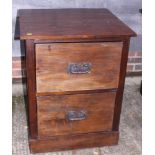 A teak/hardwood two-drawer filing cabinet with wrought iron handles, 25" wide